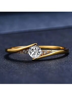 Gold Tone Solitaire Twist Ring with Clear Center Stone